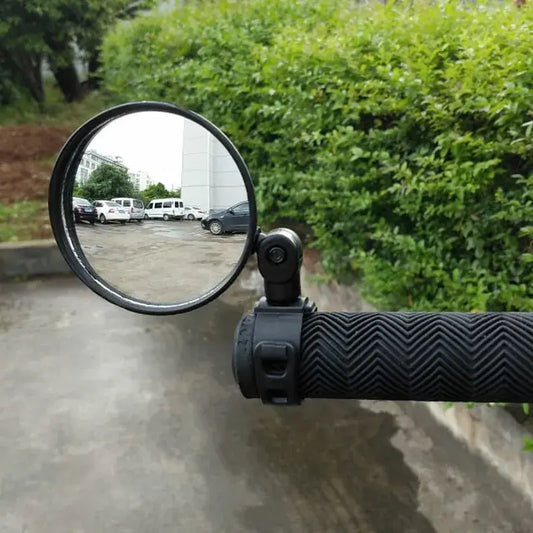 Electric scooter rearview mirror attached to handlebar, providing a clear view of traffic behind for added safety.