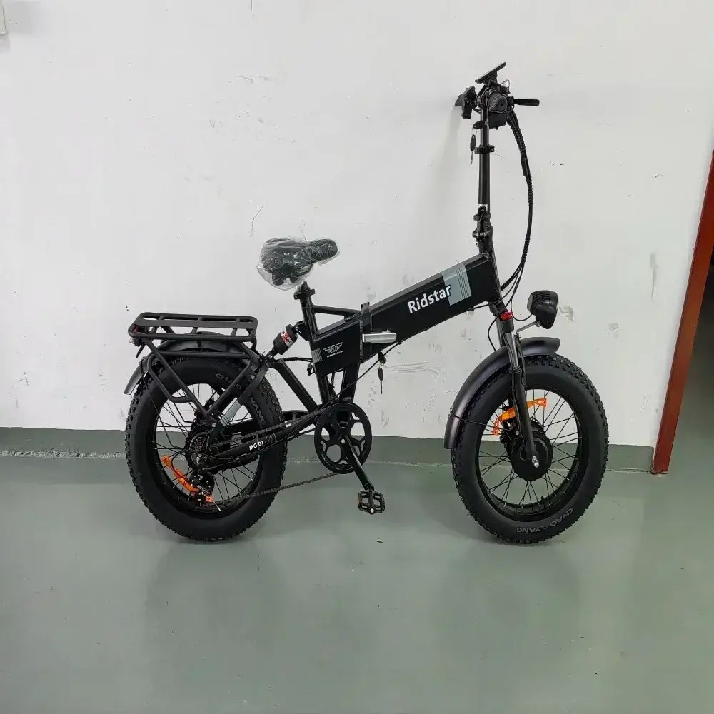 2000W H20 Pro Folding Electric Mountain Bike in sleek black design on display, showcasing fat tires and sturdy frame.