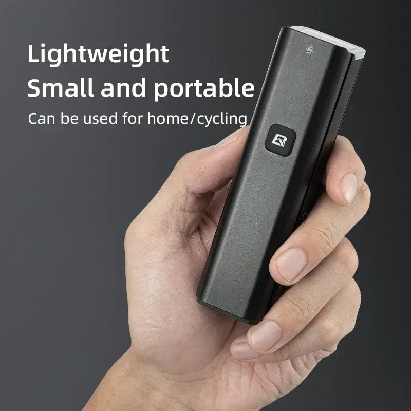 ROCKBROS lightweight portable bike light, ideal for home use and cycling, held in hand for easy demonstration.