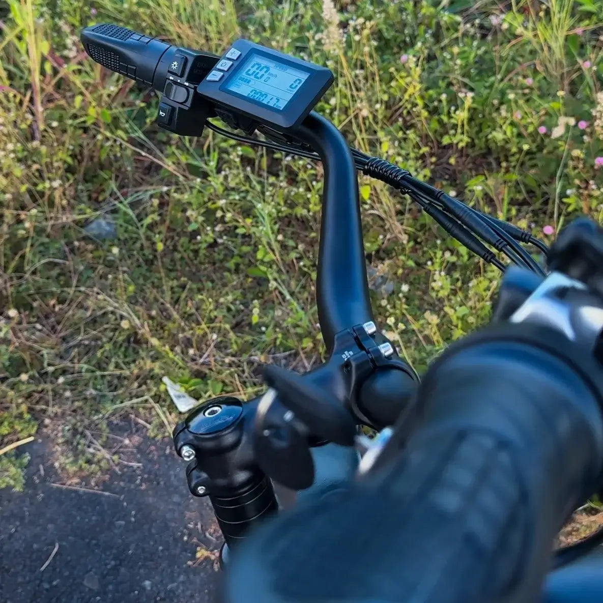 Close-up of the control panel on the Jansno X50 Electric Bike 750W motor with display and handlebar features.