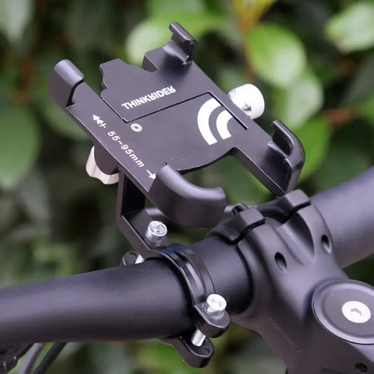 ThinkRider mobile phone stand mounted on a bicycle handlebar for navigation and anti-vibration support.