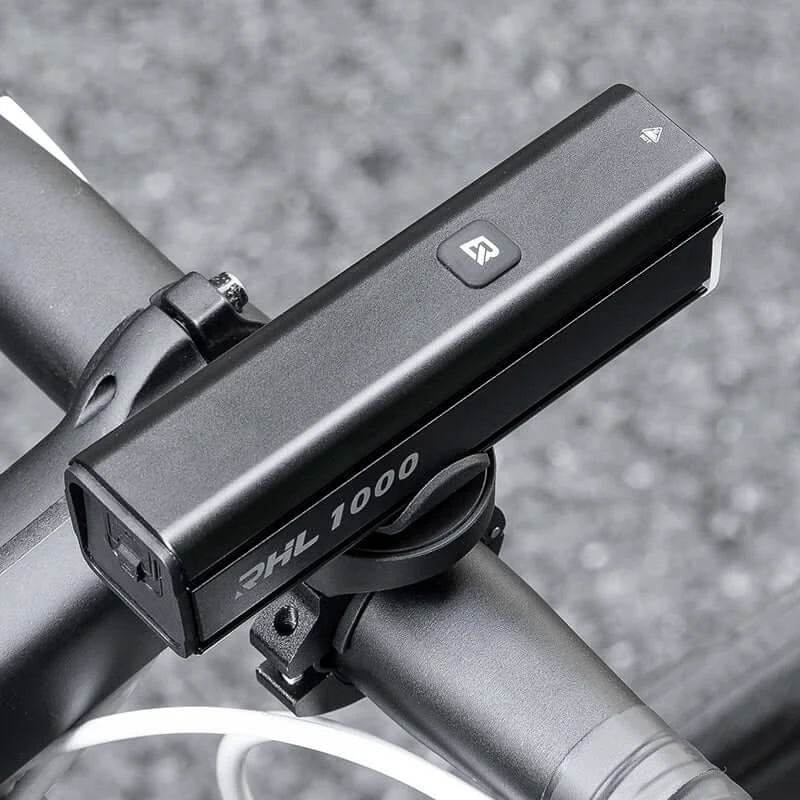 ROCKBROS 1000 Lumen Bike Light mounted on a bicycle handlebar, showcasing a sleek design and powerful illumination.