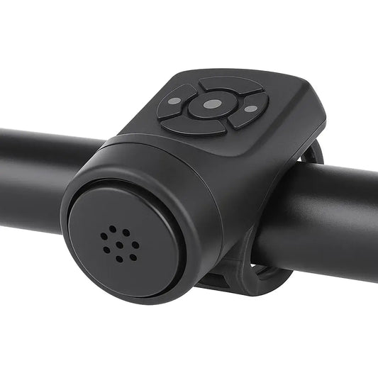 Close-up of a USB rechargeable mountain bike electric bell mounted on a handlebar for enhanced cycling safety.